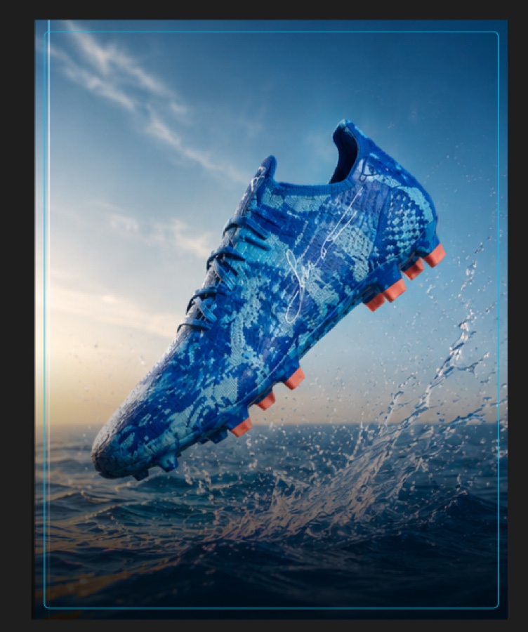 Vivid blue limited-edition Messi cleat splashing out of the ocean